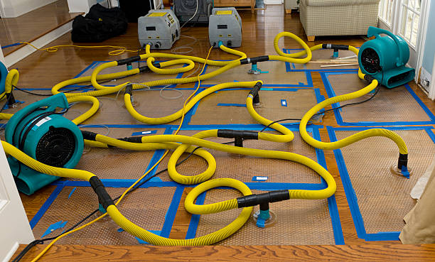 Professional Storm Water Damage Restoration technician working in Kingston, NH